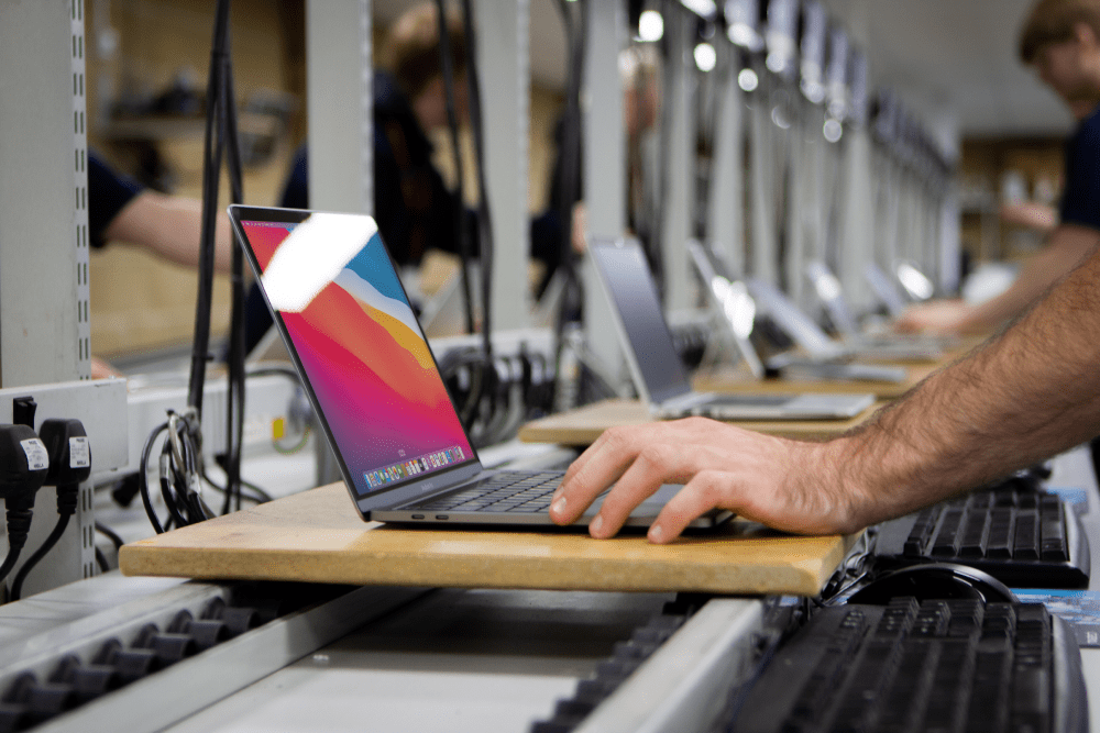 Novatech Employee boxing up Apple Macbook for D2D customer
