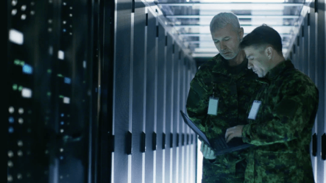 Military personnel in server room